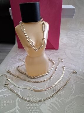 Five Unmarked Silver Mixed Chain Bracelets. Botyle Not Included.